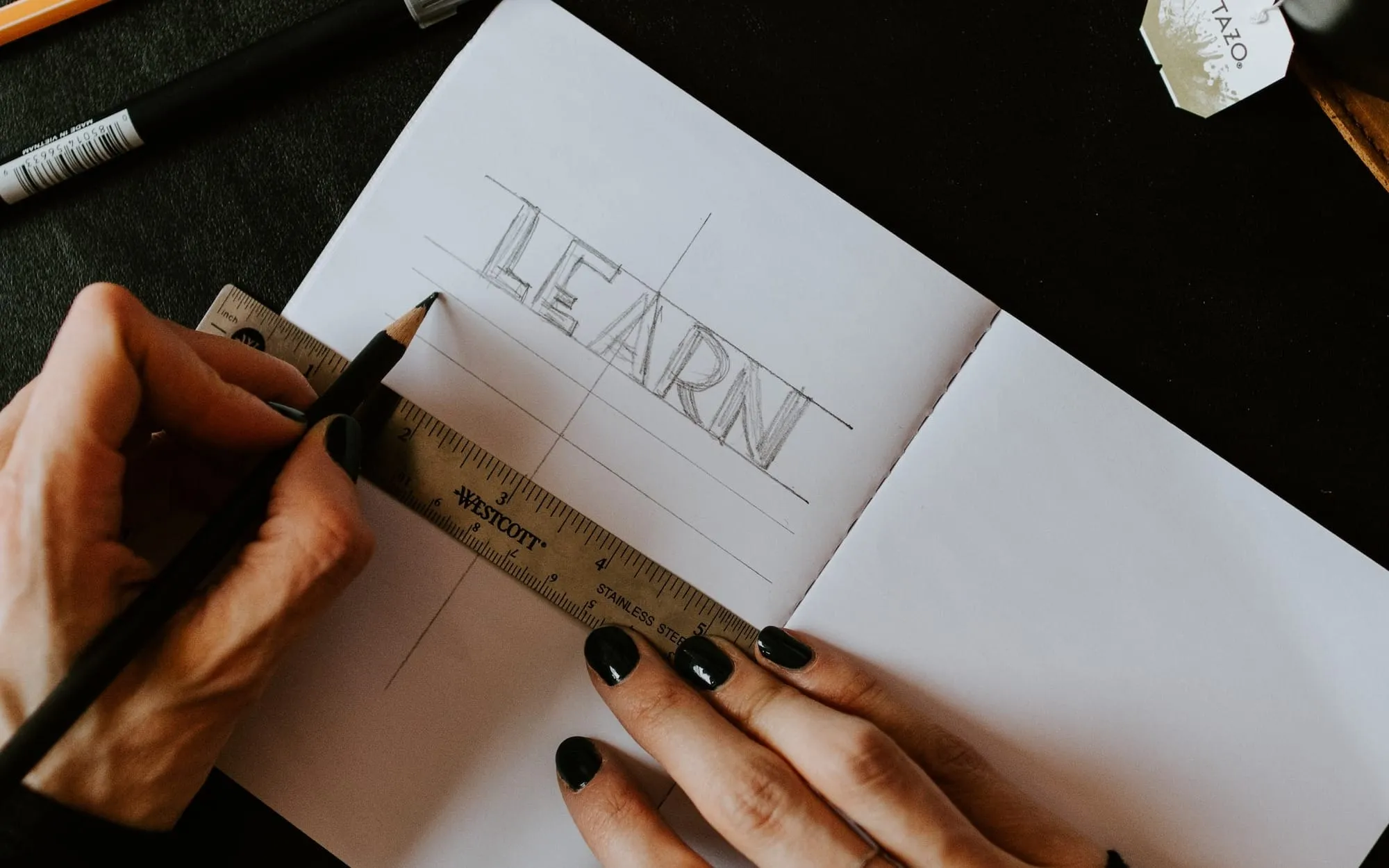 Founder taking notes on sales, marketing, and hiring lessons learned from Noah Kagan